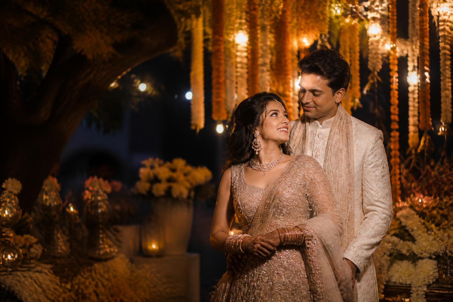 An Indian wedding celebration lit by warm evening lights